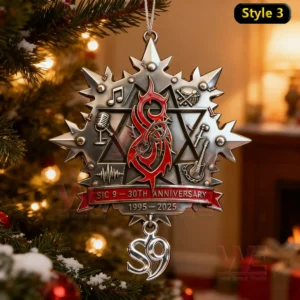 A shiny metal ornament decorated with musical imagery and a glowing central emblem displayed among festive tree branches!