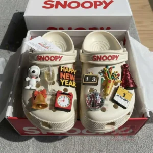 Festive themed clogs presented in a branded box with colorful charms and a joyful holiday inspired design!