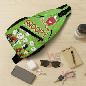 Snoopy Personalized Sling Bags 6 Top view of green Snoopy sling bag with personal items arranged around it!