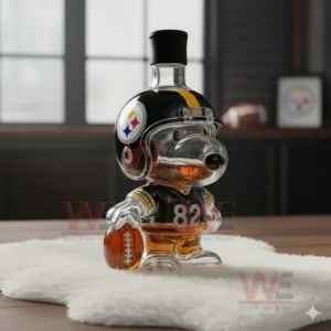 A glass dog bottle wearing a Steelers helmet and jersey placed on white fur in a room with large windows.