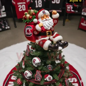 A festive Santa figure in team colors sits atop a decorated Christmas tree in a sports themed room.