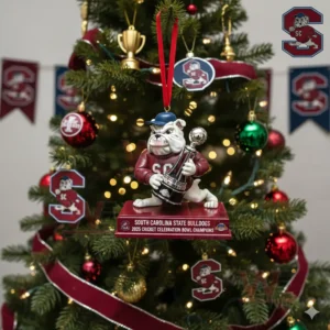 Bulldog mascot ornament hanging on a Christmas tree holding a trophy with festive team decorations!