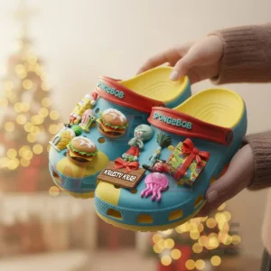 Hands presenting Spongebob themed clogs with colorful charms in a festive setting!