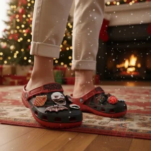 Person wearing Stranger Things themed clogs with decorative charms in a festive room!