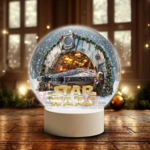 Star Wars Christmas Snowball Decoration Led Light 7 A snow globe with a spacecraft in a snowy holiday decorated hangar and a furry character in a red hat standing beside a large title at the base!