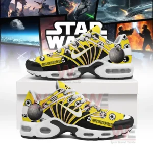 Yellow and black Star Wars shoes with film symbols displayed on a box before movie scenes!