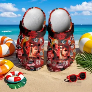 Stranger Things Crocs Crocband Clogs Shoes 6 Shoes with vivid red artwork positioned on beach sand near playful items and ocean waves!