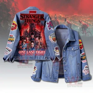 A denim jacket with large Stranger Things artwork on the back character imagery vivid red tones and themed patches on both sleeves!