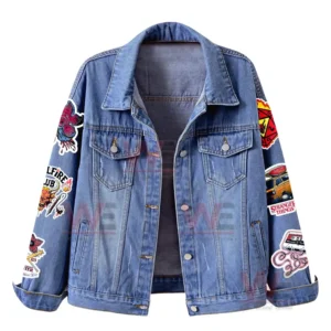 Front view of a denim jacket with multiple Stranger Things themed patches on the sleeves and a classic denim finish!