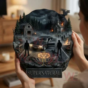 Supernatural Door Hanging Decoration Christmas Ornament 3 Person holding a supernatural themed wall decoration with a dark dramatic scene in an indoor environment!