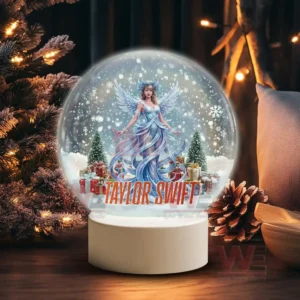 A snow globe showing a winter fairy figure resembling Taylor Swift standing among snow trees and gifts with her name displayed at the base!