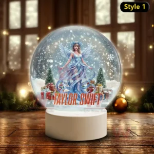 Taylor Swift Christmas Snowball Decoration Led Light 5 A snow globe with a blue dressed winter fairy figure resembling Taylor Swift surrounded by snowy trees gifts and her name at the base!
