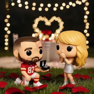Taylor Swift Travis Kelce Engagement Anniversary Pop Figure Vinyl 3 Two toy style figures recreate a marriage proposal outdoors with glowing lights heart shaped decor and scattered rose petals!