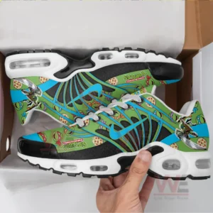 A hand holds brightly patterned sneakers from a box highlighting the animated turtle graphics and vivid color contrasts!