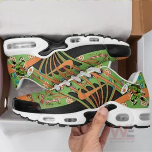 A hand holds brightly patterned sneakers from a box highlighting the animated turtle graphics and vivid color contrasts!