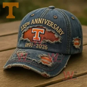 Distressed blue denim baseball cap with embroidered anniversary text orange T logo and ripped patches revealing orange fabric!