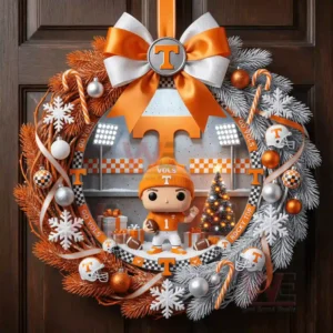 A decorative wreath on a wooden door showcasing team colors a mascot figure and holiday themed details arranged around a stadium backdrop!
