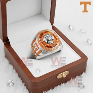 Tennessee Volunteers ring in a wooden box with white interior featuring an orange gemstone face and dog mascot emblem.