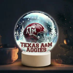 Texas A&M Aggies LED Snow Globe Night Light Christmas Ornament 5 Snowy themed decorative globe with a Texas A M Aggies helmet on a white stand!