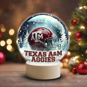 Texas A&M Aggies LED Snow Globe Night Light Christmas Ornament 7 Holiday themed snow globe with Texas A M Aggies helmet on a white base near Christmas decorations!