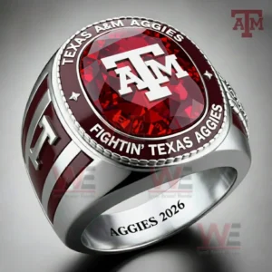 Texas AM Aggies ring with red gemstone top and ATM logo with Texas AM Aggies text and fightin texas aggies and aggies 2026 engraving.