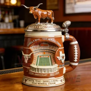 Texas Longhorns anniversary beer stein with a longhorn bull lid football handle and stadium illustration placed on a wooden bar counter!