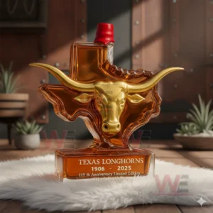 Texas Longhorns bottle shaped like a longhorn head and Texas outline with golden detailing standing on a white fur rug in a rustic interior!
