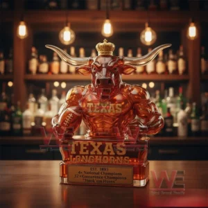 Glass whiskey bottle shaped like a crowned longhorn bull with Texas Longhorns branding displayed on a bar counter!