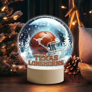 Texas Longhorns LED Snow Globe Night Light Christmas Ornament 6 Snow globe display with Texas Longhorns helmet on a white base in a festive winter setting!