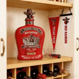 Texas Tech Red Raiders 100th Anniversary Commemorative Edition Whiskey Bottle 4 Texas Tech Red Raiders commemorative whiskey bottle displayed on a shelf with team themed decor!