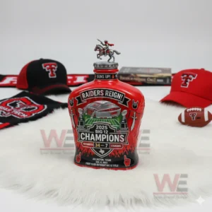 Texas Tech Red Raiders Big 12 Champions 2025 34-7 Cougars Whiskey Bottle 3 Red commemorative sports bottle on white fur with team caps books and a football in the background!