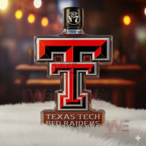 A Texas Tech T shaped bottle with a black top standing on a rug in a warm light setting!