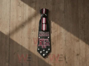 Texas Tech Red Raiders Premium Statement Necktie 3 Texas am aggies statement necktie shown on wooden background with maroon white stripe design pearl accents and bold collegiate logo presentation!