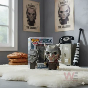 Collectible figure of The Grabber with a horned mask posed beside its box in a themed room!