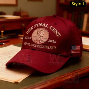 A red commemorative cap showing an embroidered cent emblem dates and text marking a final issue.