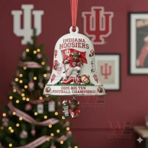 A white bell ornament with mascots trophy and football details hanging on a Christmas tree in a team themed room!