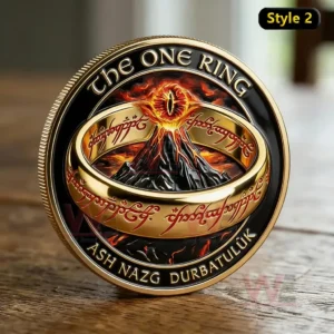 The Lord of the Rings One Journey, One Ring 25th Anniversary Commemorative Coin 3 A fantasy commemorative coin showing a golden ring with engraved script over a fiery volcano background standing on a wooden table!