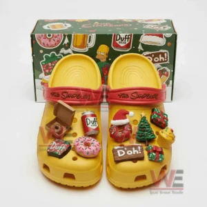 Yellow cartoon themed clogs with christmas charms displayed in front of a matching festive box!