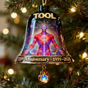 Bell ornament with a glowing humanoid figure cosmic patterns and anniversary text hanging on a Christmas tree!