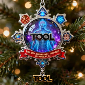 Cosmic themed anniversary ornament featuring a glowing humanoid figure symbolic shapes and a red banner hanging on a Christmas tree!