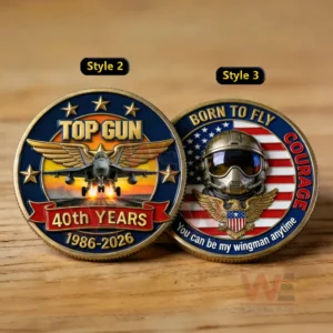 Top Gun fortieth anniversary commemorative coin with fighter jet stars and patriotic colors on a wooden background