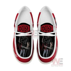 Top view of Trace Adkins themed Hey Dude shoes with red accents white laces and inner artwork of a guitarist!