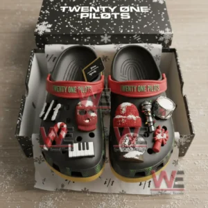 Black clogs with Twenty One Pilots charms arranged inside a snowflake patterned gift box!