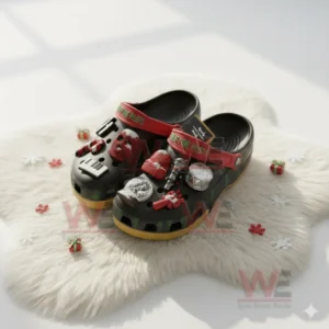 Decorated black clogs with Twenty One Pilots charms on a white fluffy rug surrounded by small festive items!