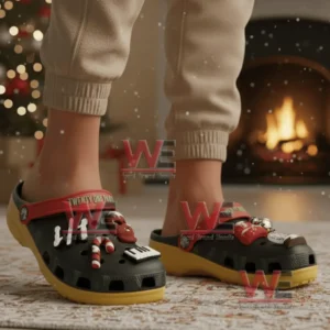 Person wearing decorated Twenty One Pilots clogs near a fireplace with holiday decorations!