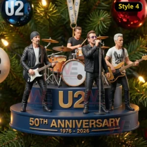 The image displays a band performing on a blue anniversary stage hanging on a Christmas tree.