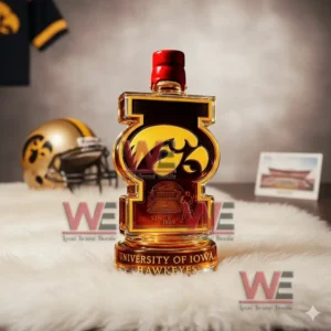 A University of Iowa themed bottle placed on a white fur mat with a football helmet and decor items in the background!