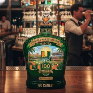 Green University of Miami anniversary bottle on a bar counter with a bird topper and Go Canes label.