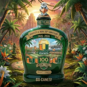 University of Miami one hundred year anniversary bottle with bird topper in a tropical sunset setting.