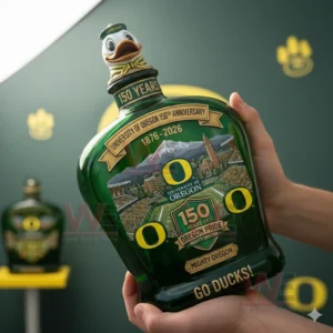 Hands holding a green University of Oregon anniversary whiskey bottle with detailed artwork!